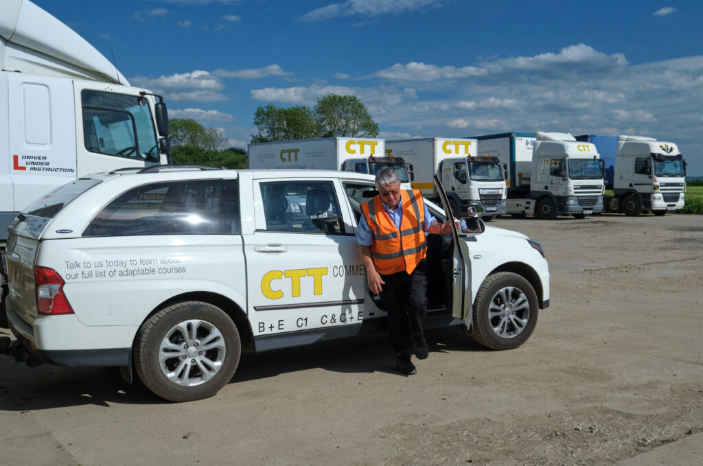 A CTT instructor exiting his training vehicle