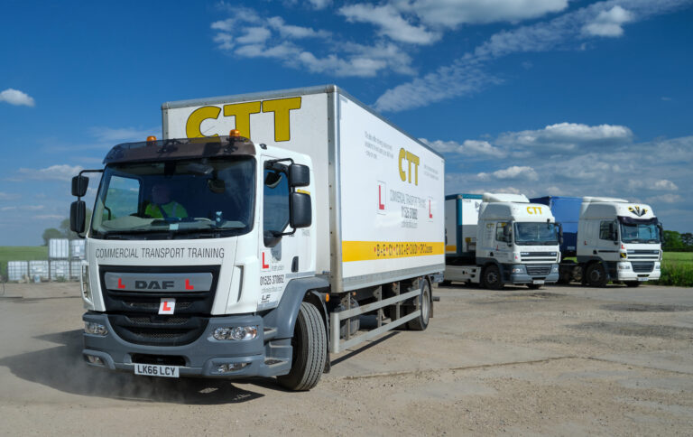 A picture of a commercial transport training lorry departing for a training session