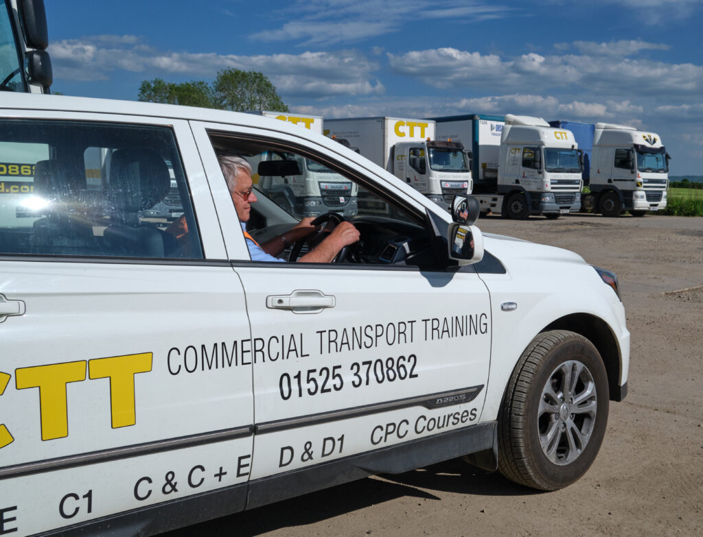 image of a worker driving a commercial transport training vehicle