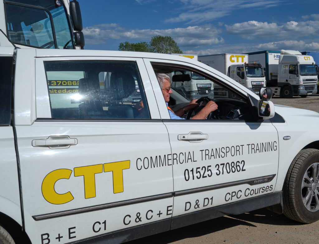 image of a worker driving a commercial transport training vehicle