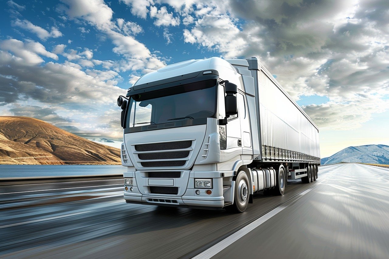 image of a white lorry driving on the road